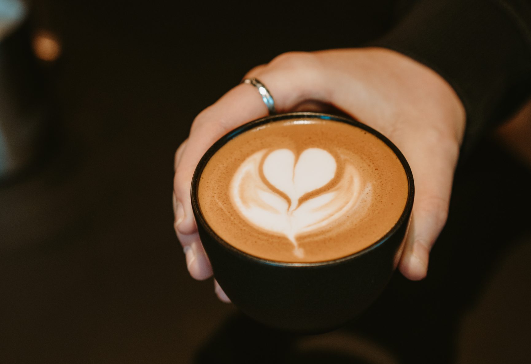 A heart flower drawn into coffee.
